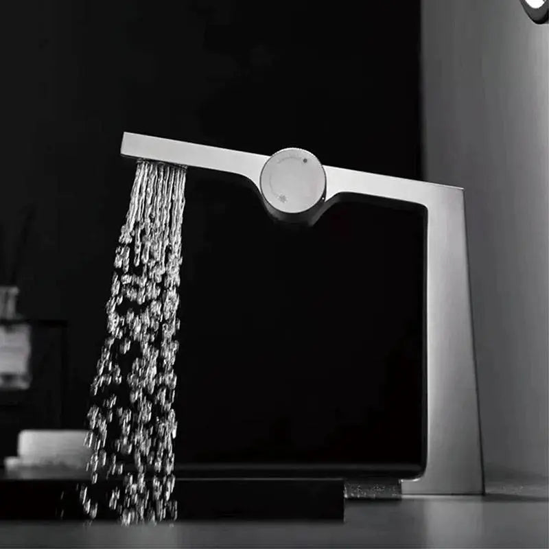 Nona luxury waterfall bathroom faucet – elegant and modern design with a wide spout for a smooth, cascading water flow, adding a spa-like touch to any bathroom.