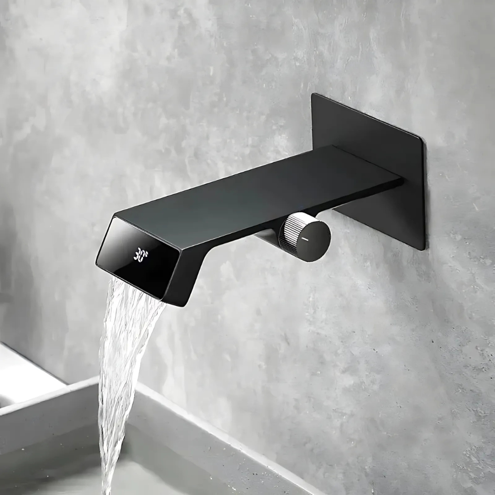 Modern LED waterfall bathroom faucet – sleek and contemporary design with a wide spout for a smooth cascading flow, featuring built-in LED lights that change color with water temperature for a luxurious touch.