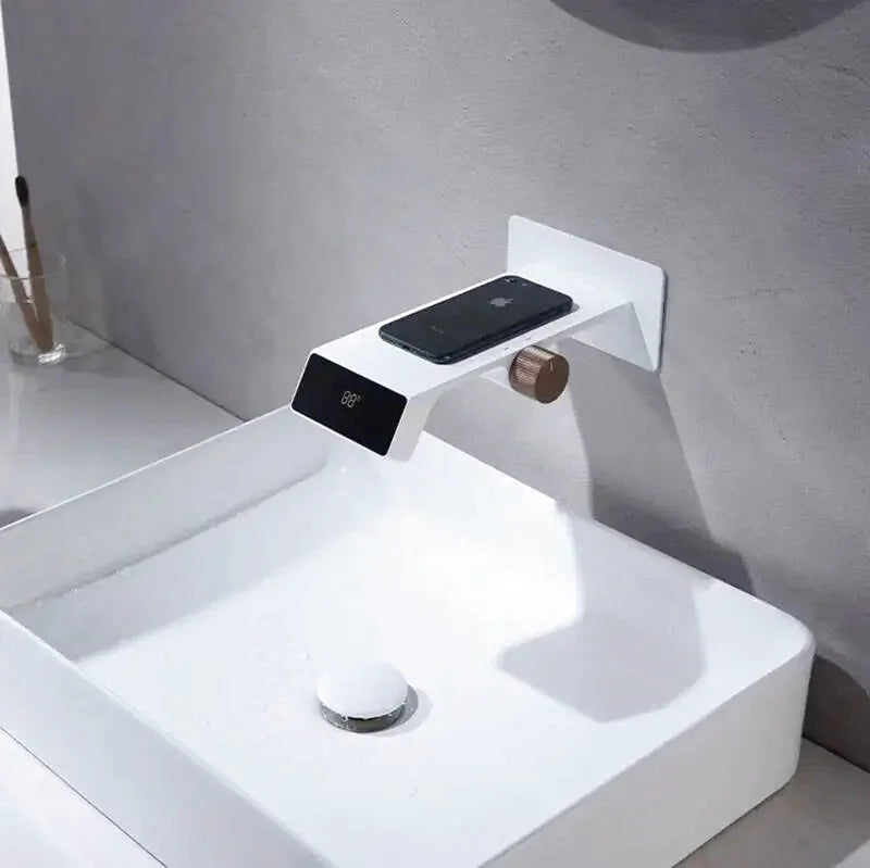 Modern LED waterfall bathroom faucet – sleek and contemporary design with a wide spout for a smooth cascading flow, featuring built-in LED lights that change color with water temperature for a luxurious touch.